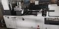 Machine à poser les fenêtres des cartons (Station Window Patcher)