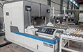 Machine de cerclage pour carton ondulé